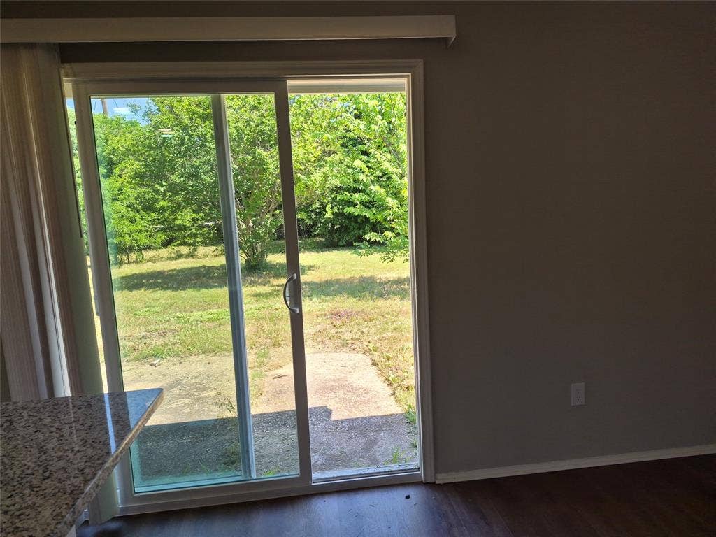 117 Yorkshire Drive, Cedar Hill, TX 75104 Sliding glass door opening to a private backyard with mature trees
