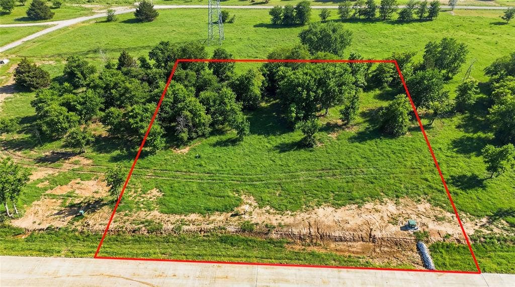 This is an aerial photograph of Lot 4 Block G and was captured in February. It has been digitally enhanced to emphasize the presence of leaves and grass.