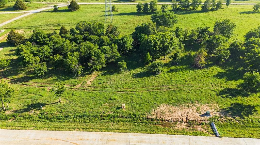 This is an aerial photograph of Lot 4 Block G and was captured in February. It has been digitally enhanced to emphasize the presence of leaves and grass.