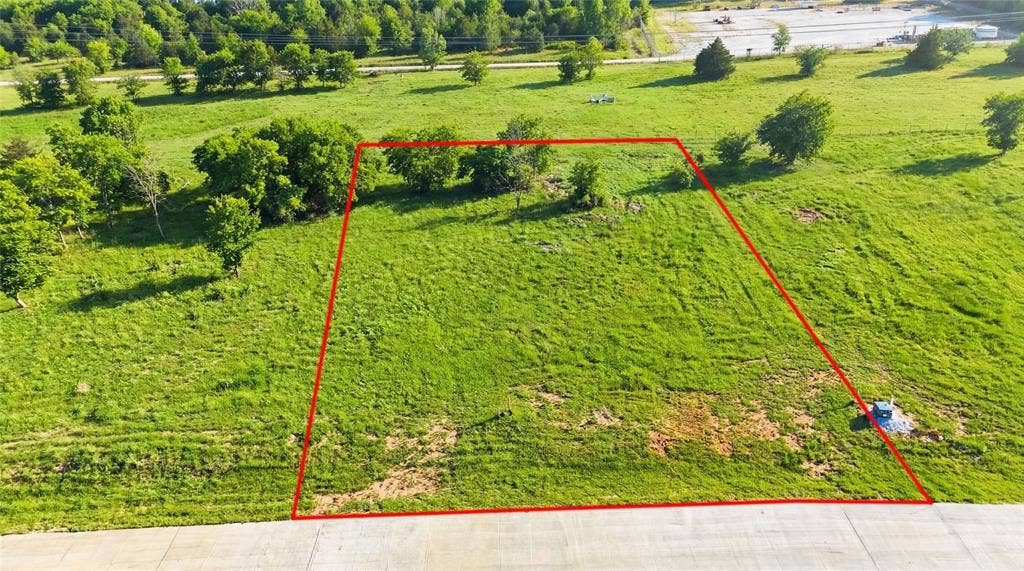 This is an aerial photograph of Lot 2 Block G and was captured in February. It has been digitally enhanced to emphasize the presence of leaves and grass.