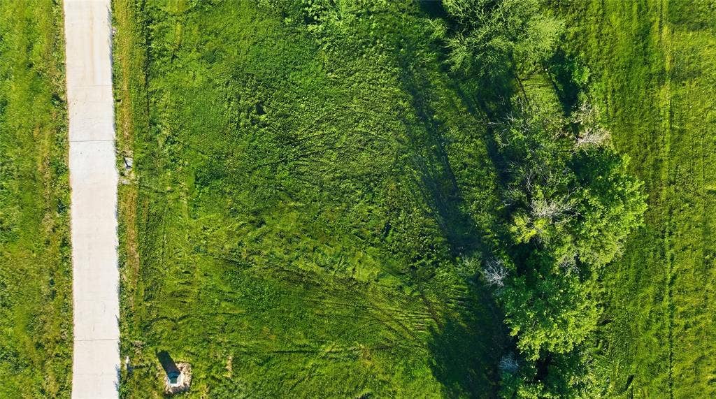 This is an aerial photograph of Lot 2 Block G and was captured in February. It has been digitally enhanced to emphasize the presence of leaves and grass.