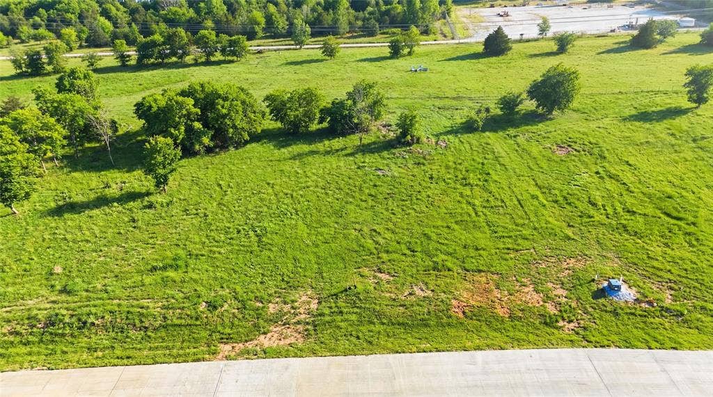 This is an aerial photograph of Lot 2 Block G and was captured in February. It has been digitally enhanced to emphasize the presence of leaves and grass.