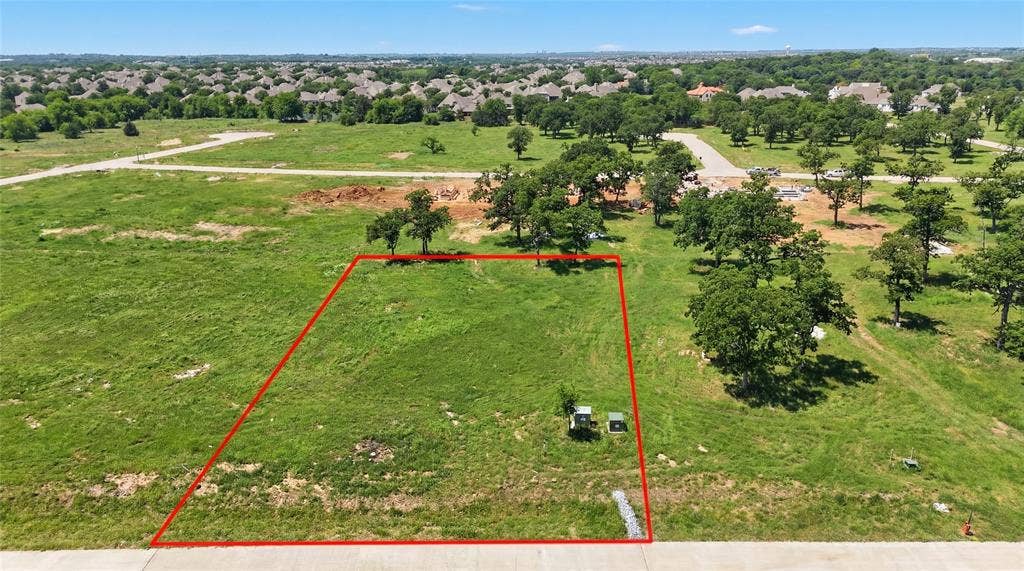 This is an aerial photograph of Lot 8 Block J and was captured in February. It has been digitally enhanced to emphasize the presence of leaves and grass.