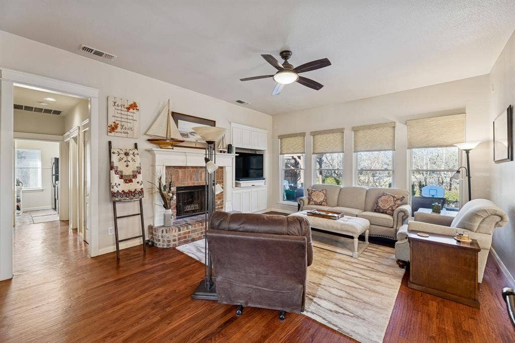 1924 Victoria Circle, McKinney, TX 75072 Gas logs in the fireplace and remote blinds to look out and the pool and greenery