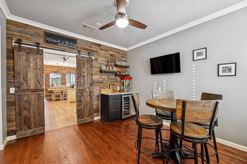 1924 Victoria Circle, McKinney, TX 75072 Formal dining area now being used as bar gathering area. Gorgeous barn doors