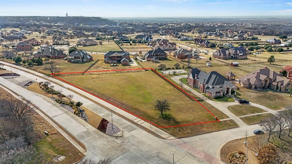 2502 Texas Plume Road, Cedar Hill, TX 75104 Aerial perspective of suburban area with property parcel outlined