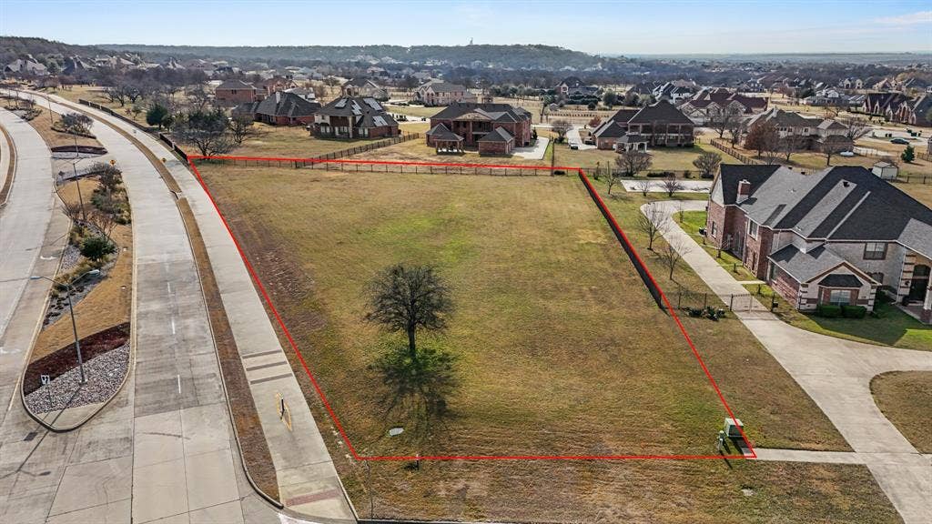2502 Texas Plume Road, Cedar Hill, TX 75104 Aerial perspective of suburban area with property parcel outlined