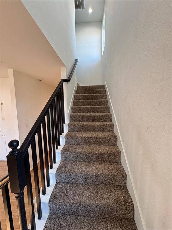 4209 Metropolitan Avenue, Dallas, TX 75210 Stairs lead to upstairs bedroom and bath.
