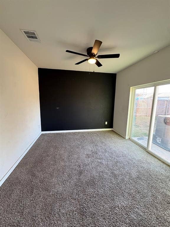 4209 Metropolitan Avenue, Dallas, TX 75210 Flex room with ceiling fan and sliding doors open to patio and backyard.