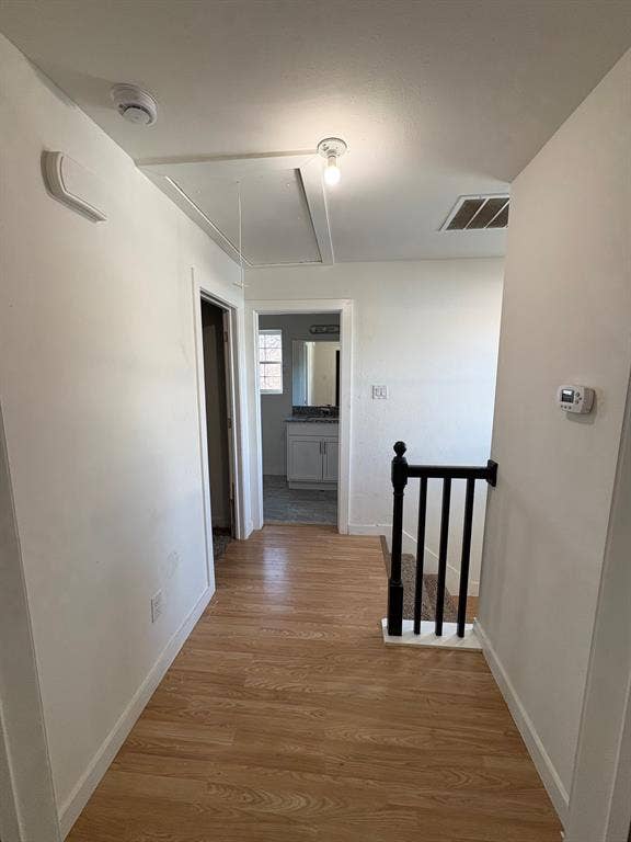 4209 Metropolitan Avenue, Dallas, TX 75210 Upstairs landing. Disappearing stairs open to attic.