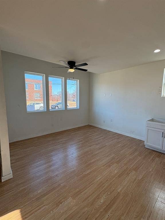 4209 Metropolitan Avenue, Dallas, TX 75210 Living area is open to kitchen and dining area. Ceiling fan.