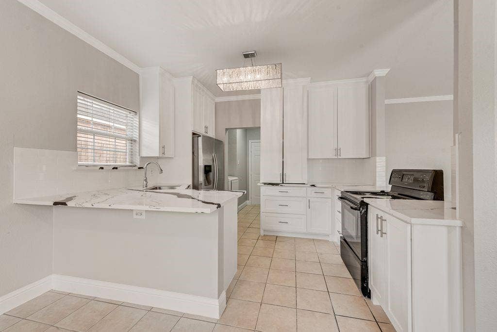 400 Buckskin Drive, Red Oak, TX 75154 Kitchen has been totally remodeled! New Quartz countertops, new Sink, New Cabinets, New paint!