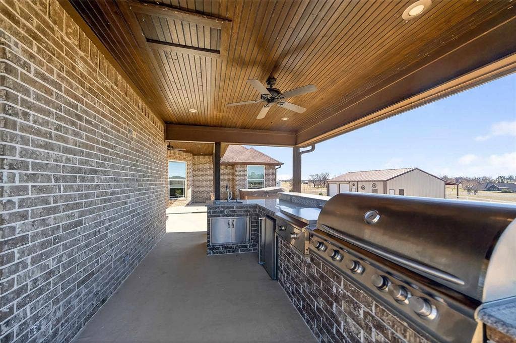 23151 Champion Drive, Lindale, TX 75771 View of patio featuring ceiling fan and an outdoor kitchen