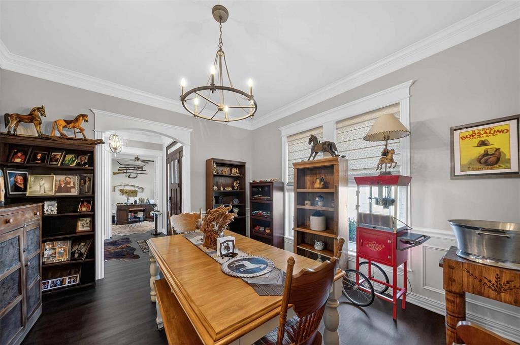 23151 Champion Drive, Lindale, TX 75771 Dining space featuring ornamental molding, a chandelier, dark wood-style flooring, and arched walkways