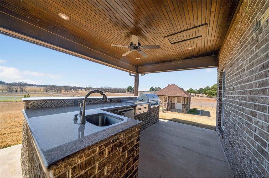23151 Champion Drive, Lindale, TX 75771 View of patio with area for grilling and a ceiling fan
