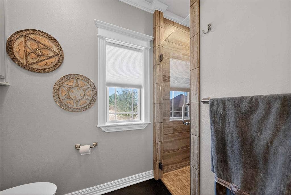 23151 Champion Drive, Lindale, TX 75771 Bathroom with a shower stall and crown molding