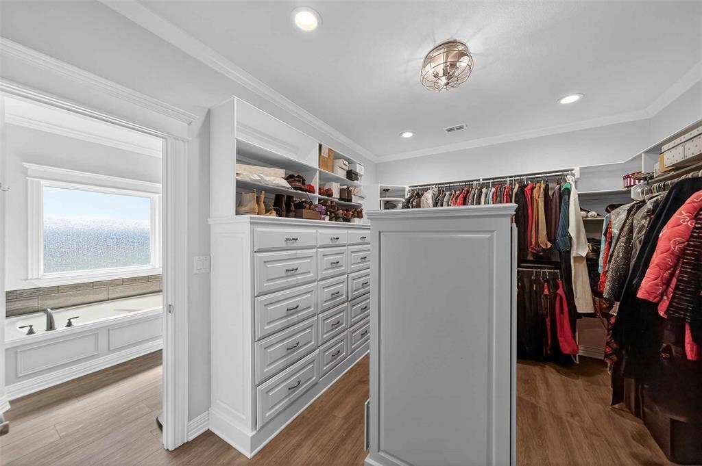 23151 Champion Drive, Lindale, TX 75771 Walk in closet with dark wood-type flooring
