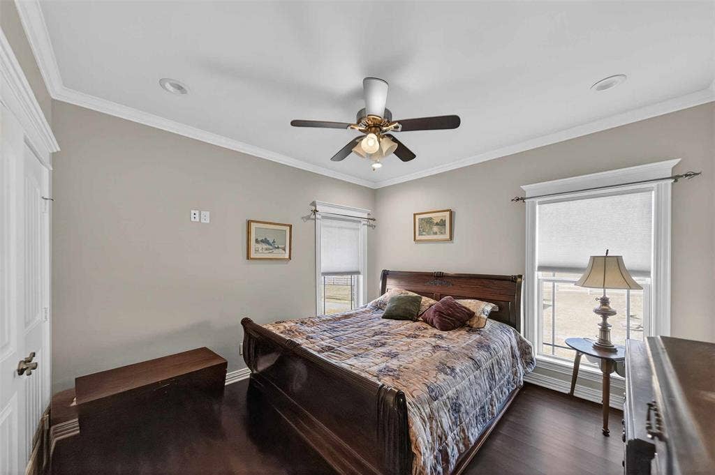 23151 Champion Drive, Lindale, TX 75771 Bedroom featuring crown molding, dark wood-style floors, and ceiling fan
