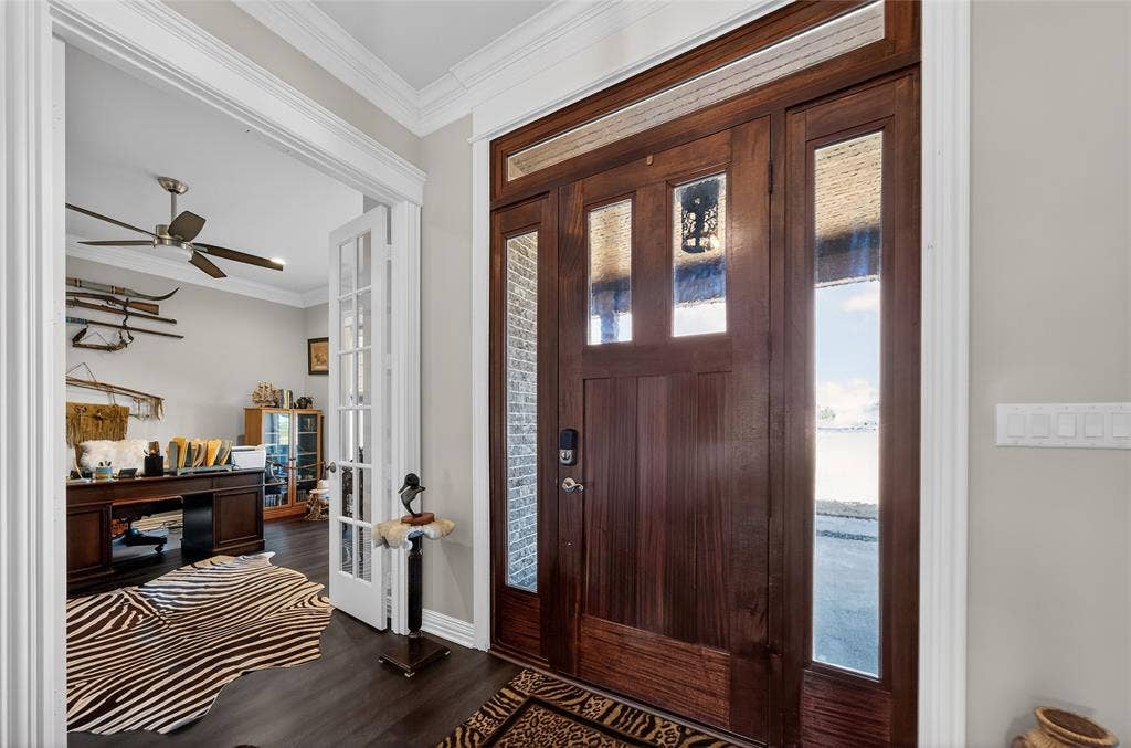 23151 Champion Drive, Lindale, TX 75771 Foyer featuring ornamental molding, a ceiling fan, dark wood-type flooring, and french doors