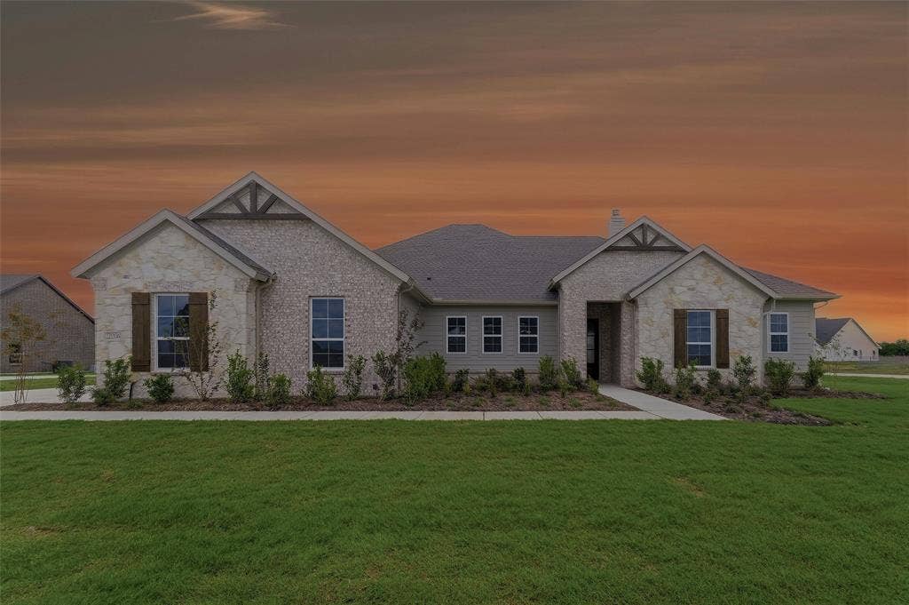2204 Continent Court, Krum, TX 76249 Single-story residence featuring a mixed-material facade with stone and brick accents