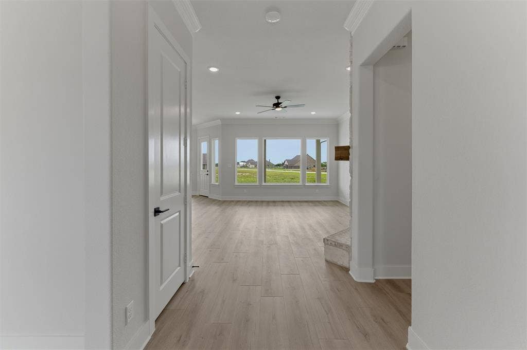 2204 Continent Court, Krum, TX 76249 Expansive room featuring light wood-finish flooring, recessed lighting, and a ceiling fan