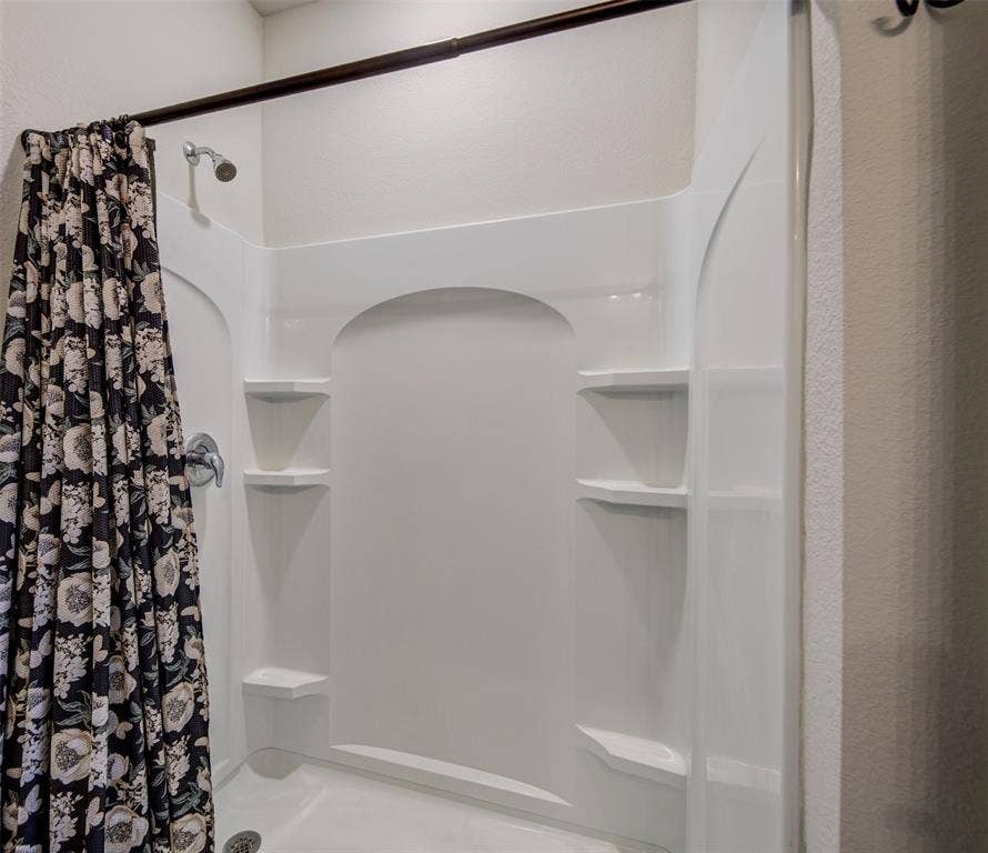 Bathroom with a stall shower