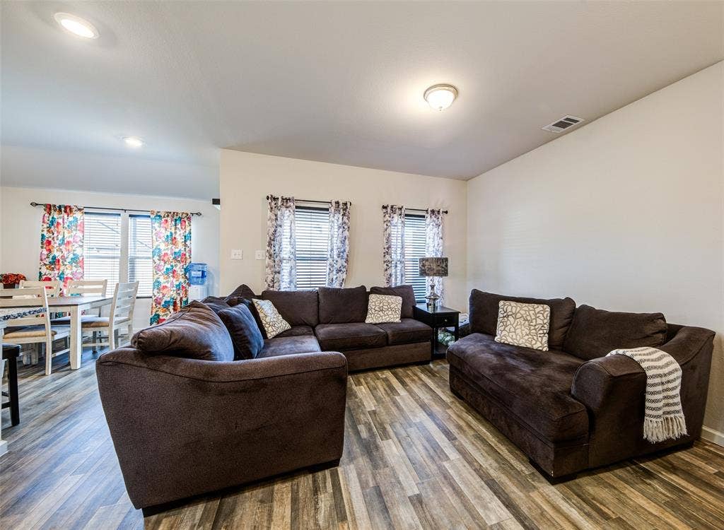 Living room featuring wood finished floors and recessed lighting