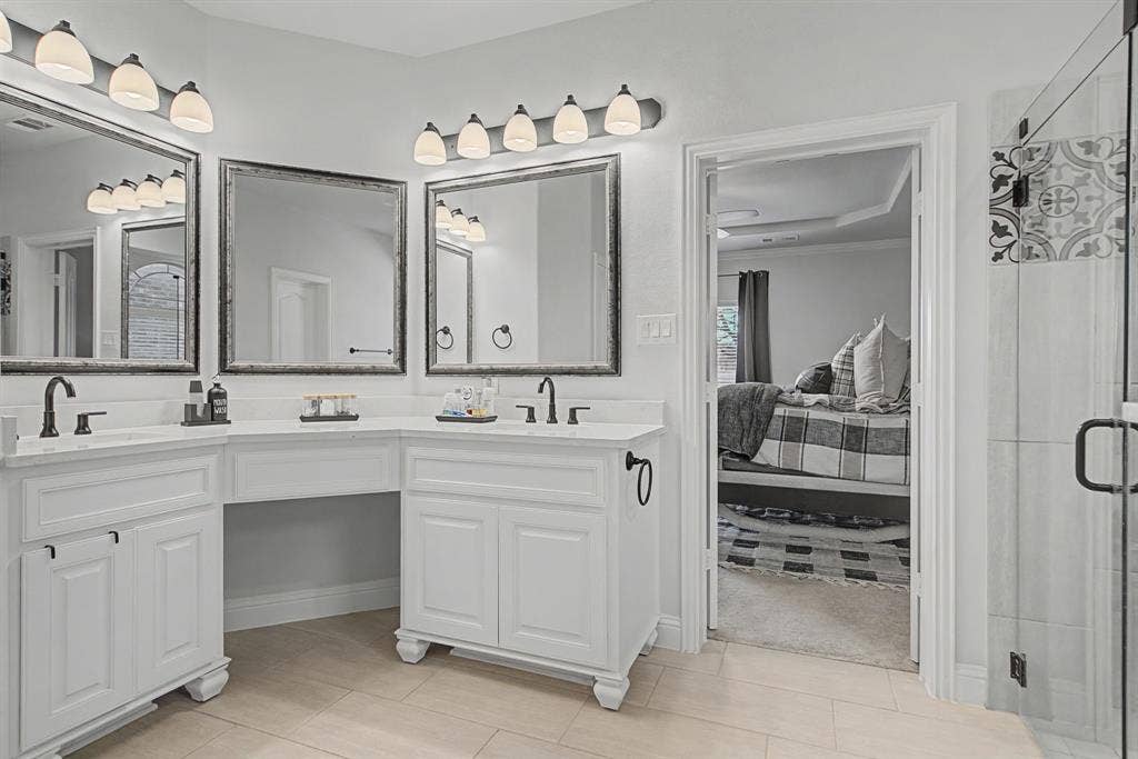 3409 Florence Drive, Corinth, TX 76210 Full bathroom featuring double vanity and a stall shower