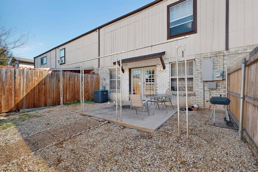 2315 Blue Sage Lane, Arlington, TX 76014 Back of house with a patio area, a fenced backyard, french doors, and brick siding