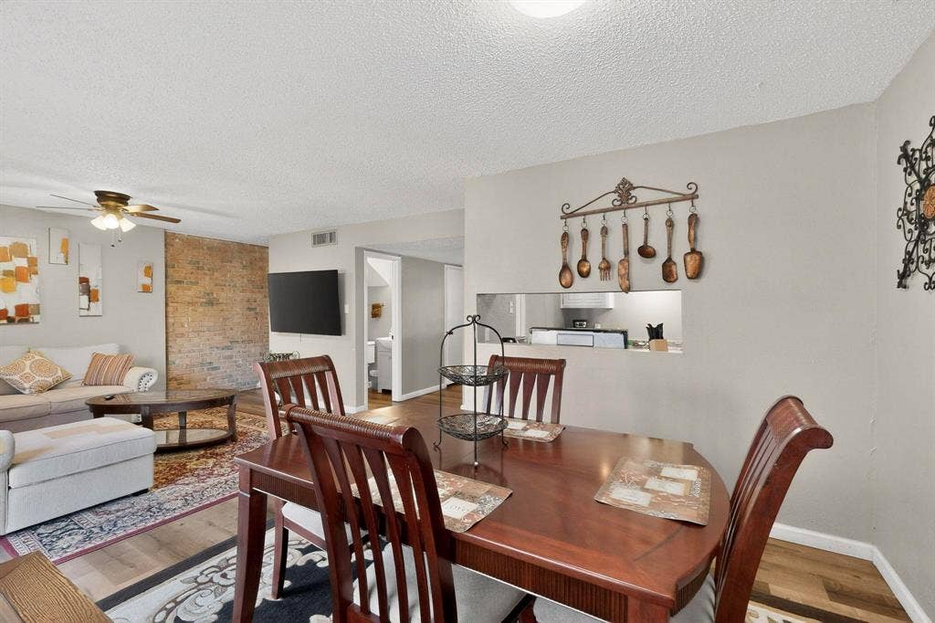 2315 Blue Sage Lane, Arlington, TX 76014 Dining space with wood finished floors, ceiling fan, and a textured ceiling
