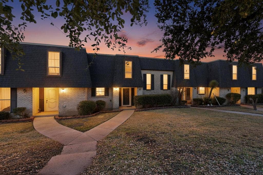 2315 Blue Sage Lane, Arlington, TX 76014 View of front of property featuring mansard roof, brick siding, a front yard, and roof with shingles