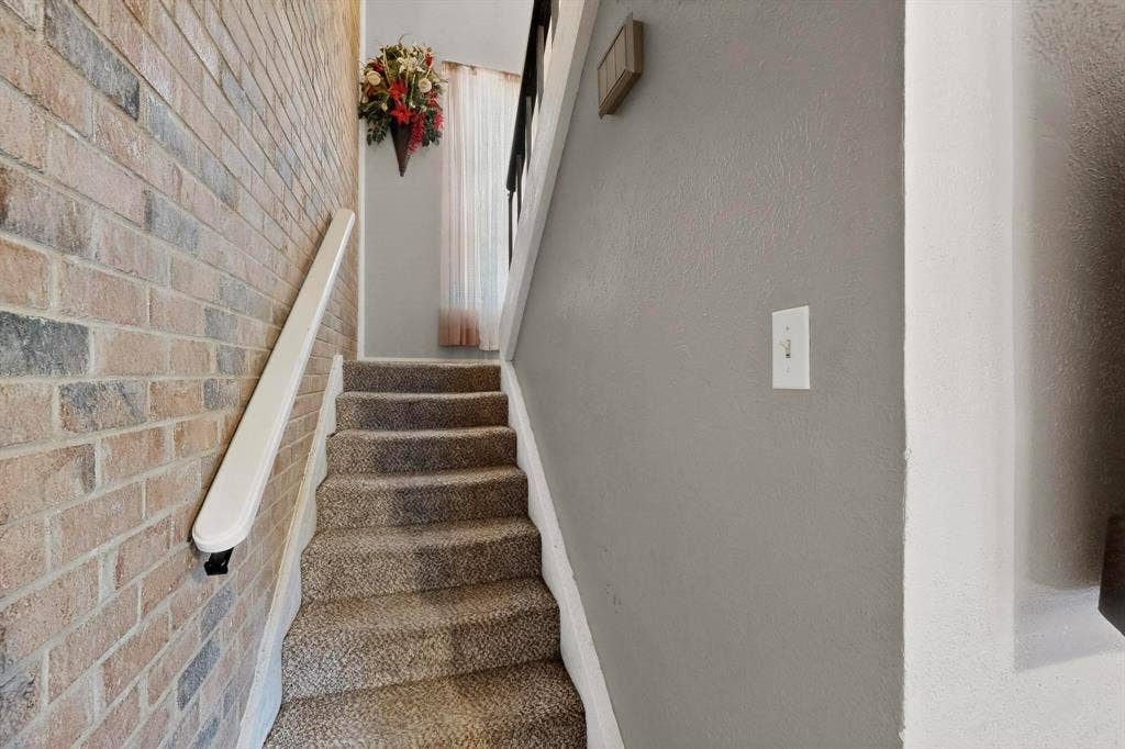 2315 Blue Sage Lane, Arlington, TX 76014 Stairs featuring brick wall