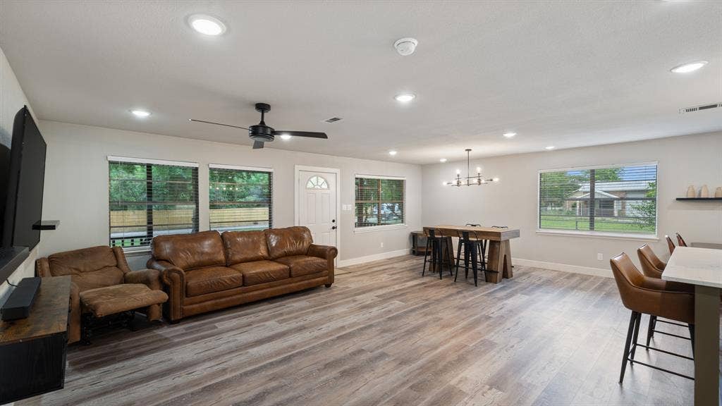 129 King Arthur Road, Mabank, TX 75156 The living area features recessed lighting, light-colored walls, and wood-look flooring