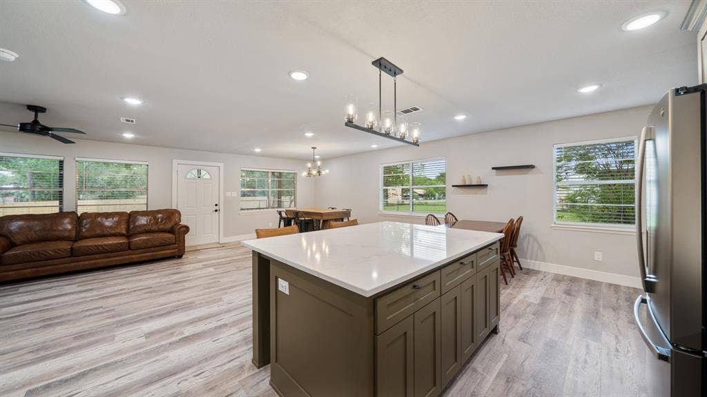 129 King Arthur Road, Mabank, TX 75156 The property features an open-concept layout with light-colored flooring throughout
