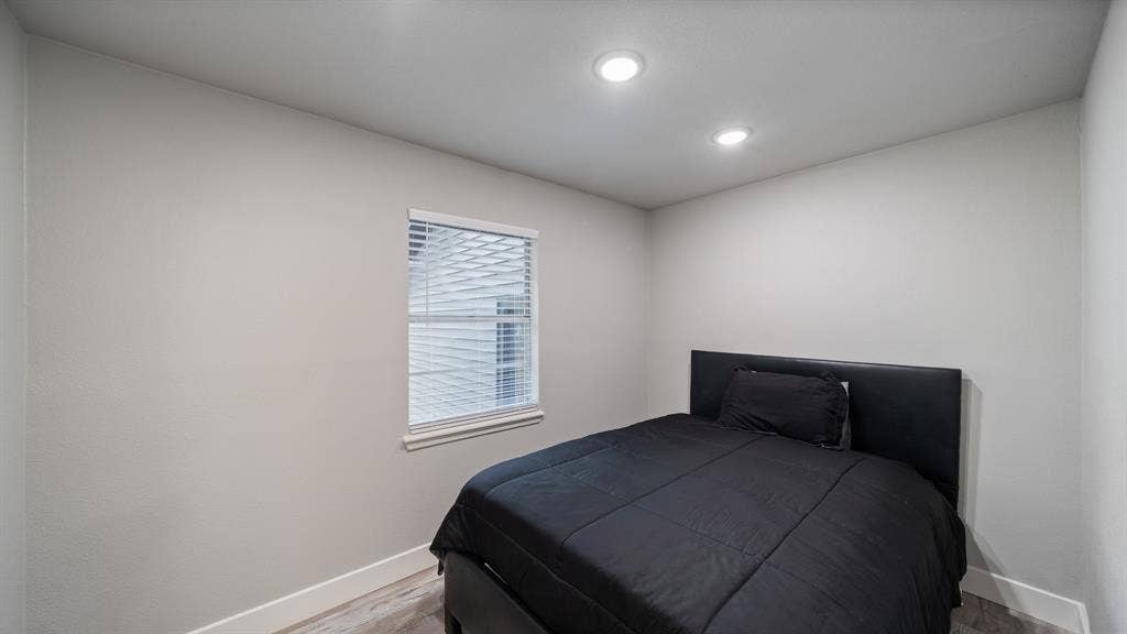 129 King Arthur Road, Mabank, TX 75156 This room features recessed lighting, a window with blinds, and light-colored walls