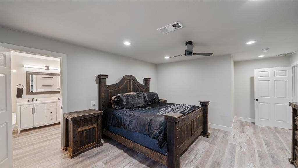 129 King Arthur Road, Mabank, TX 75156 This bedroom features light-colored flooring, recessed lighting, and a ceiling fan