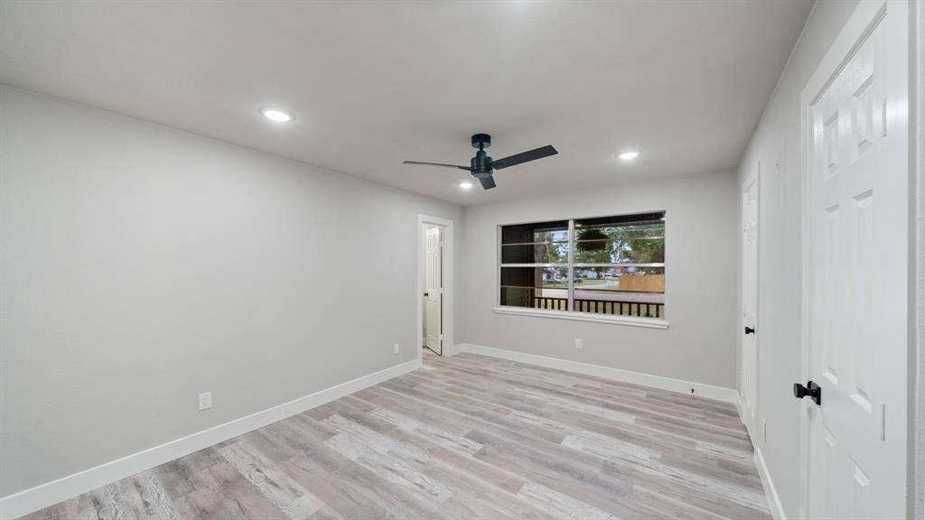 129 King Arthur Road, Mabank, TX 75156 Property exterior featuring dark gray siding, a covered porch with wooden posts, and an attached two-car garage