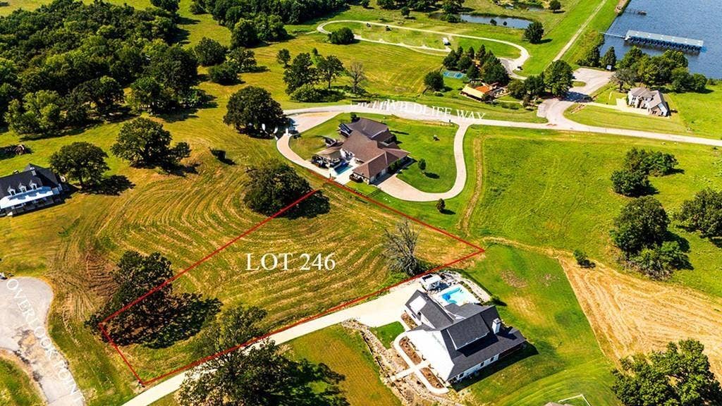 LOT 246 OVERLOOK Point, Athens, TX 75752 Aerial view of property and surrounding area with property parcel outlined and a nearby body of water