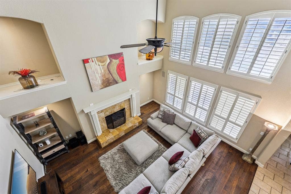 Open Living Area with Fireplace Overlooking the Pool