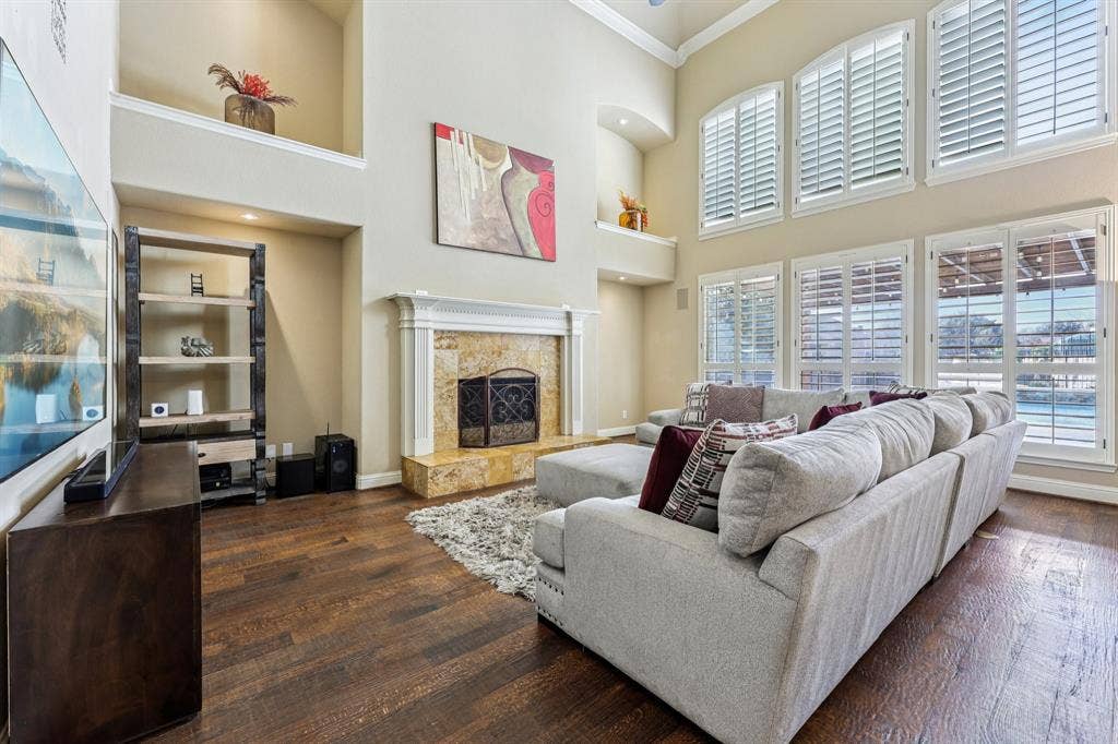 Open Living Area with Fireplace Overlooking the Pool