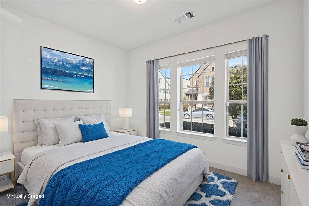 648 Courtyard Lane, Irving, TX 75039 First floor bedroom with light carpet and baseboards