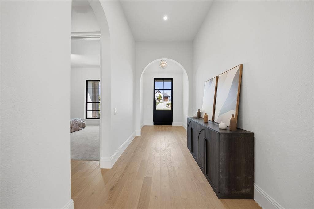 3333 Bridgegate Avenue, Northlake, TX 76247 Archway entry, wood-finish flooring, white walls, recessed lighting, and a black-framed glass door