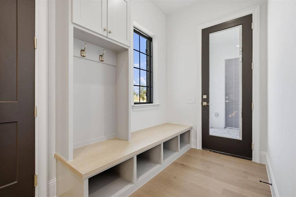 3333 Bridgegate Avenue, Northlake, TX 76247 Built-in mudroom bench with cubby storage, upper cabinetry, and coat hooks