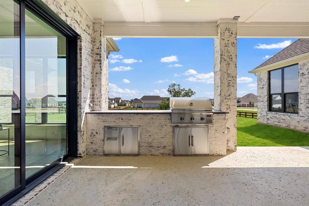 3333 Bridgegate Avenue, Northlake, TX 76247 Covered patio with an outdoor kitchen, built-in grill, and sliding glass door access