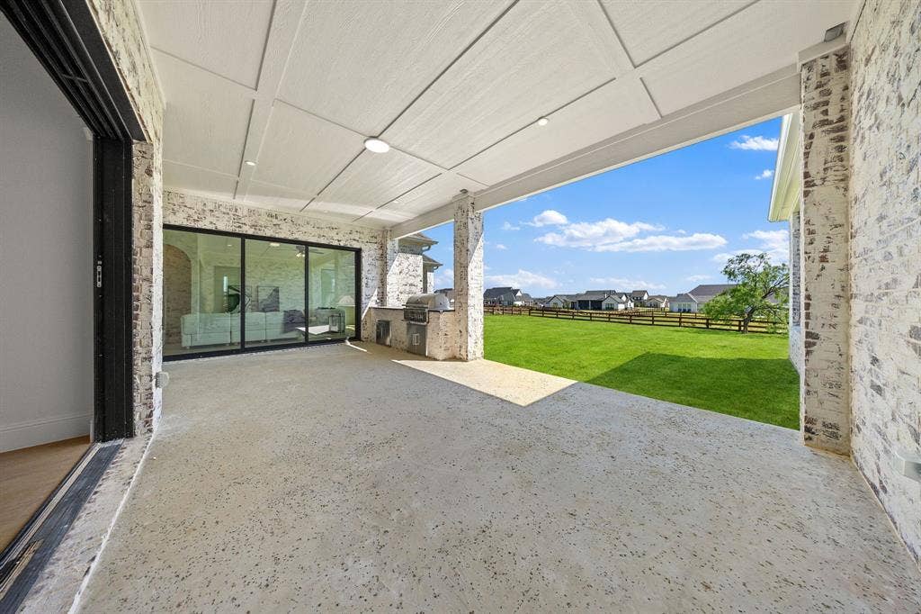 3333 Bridgegate Avenue, Northlake, TX 76247 Covered patio with a board and batten ceiling, recessed lighting, and brick-clad columns