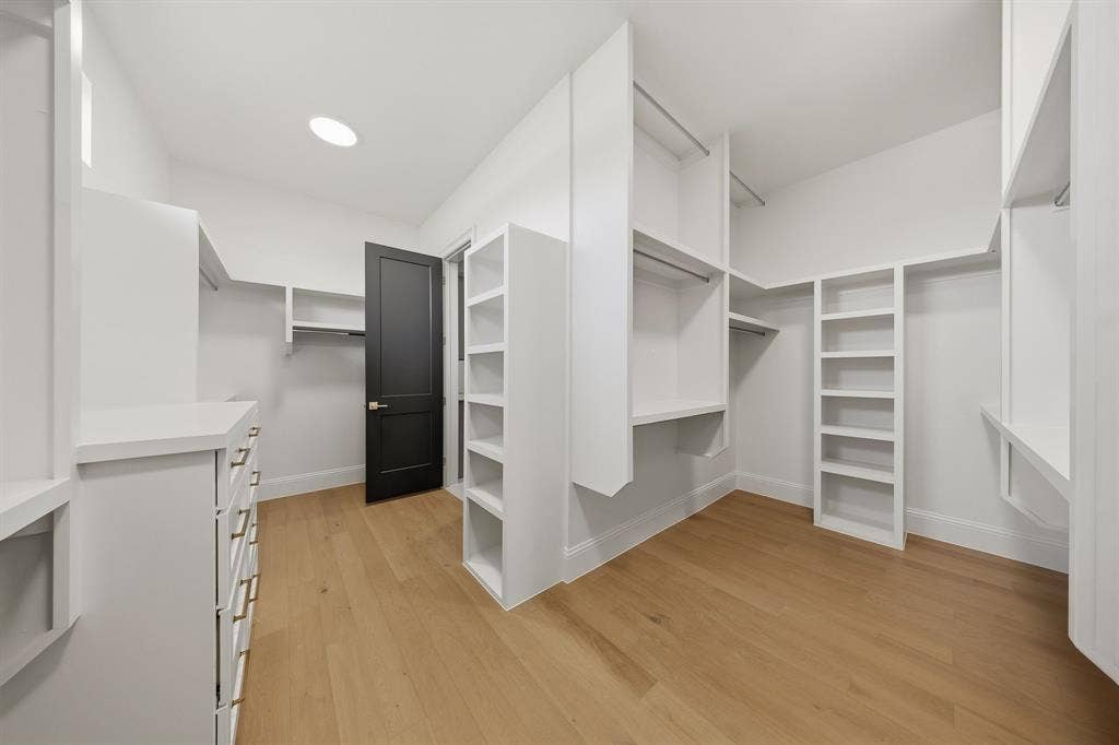 3333 Bridgegate Avenue, Northlake, TX 76247 Walk-in closet with wood-finish flooring, recessed lighting, built-in shelving, hanging rods, and a built-in drawer unit