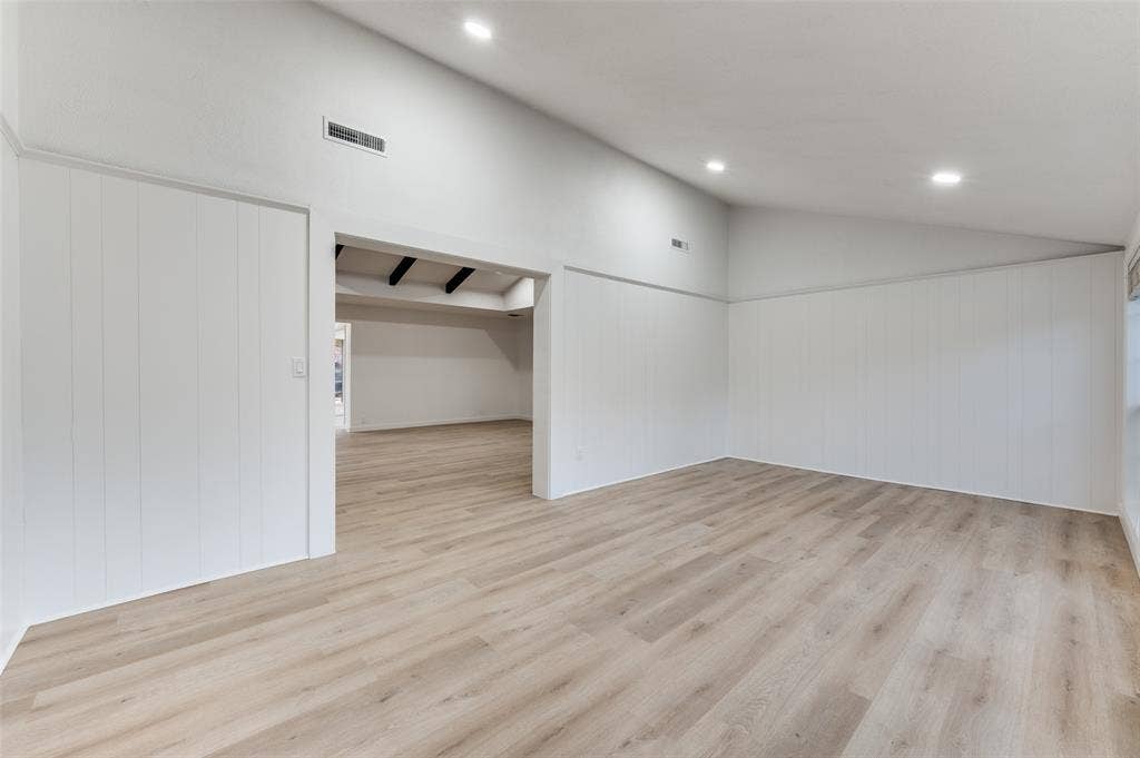 2601 Red Oak Lane, Plano, TX 75075 Vaulted bonus lounge with shiplap detail and direct backyard access—ideal as a media room, fitness studio, creative space, or relaxed secondary living area.