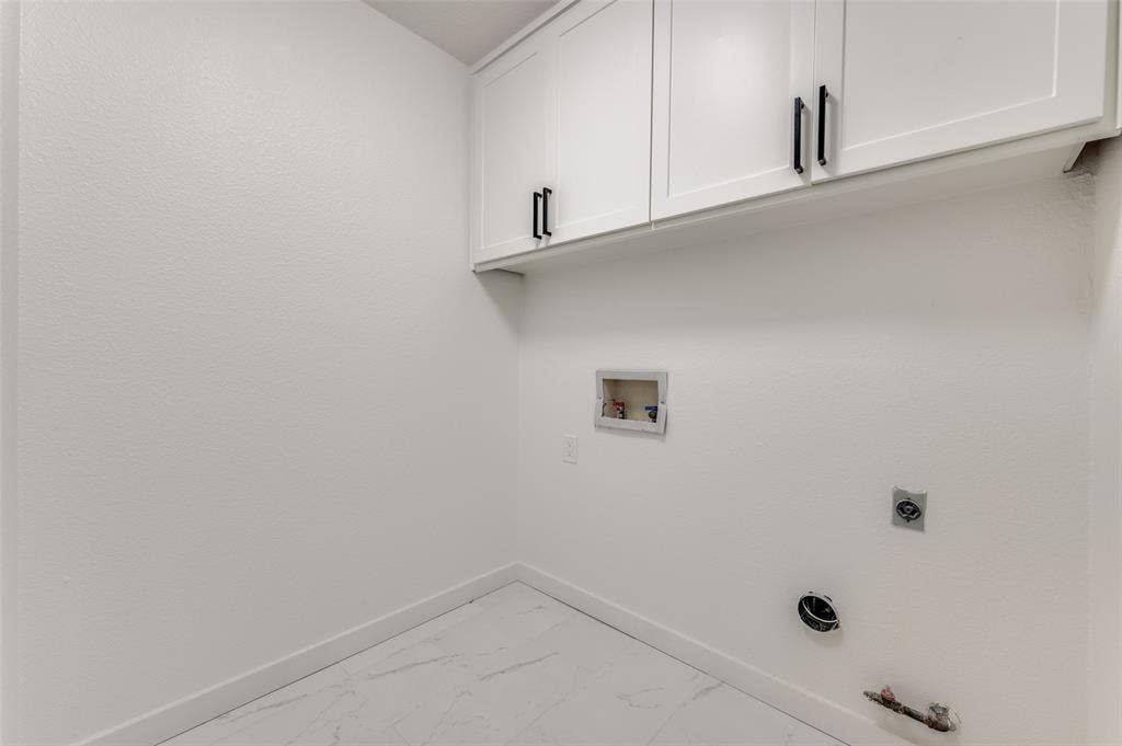 2601 Red Oak Lane, Plano, TX 75075 Dedicated laundry room with new cabinetry and closet for storage.