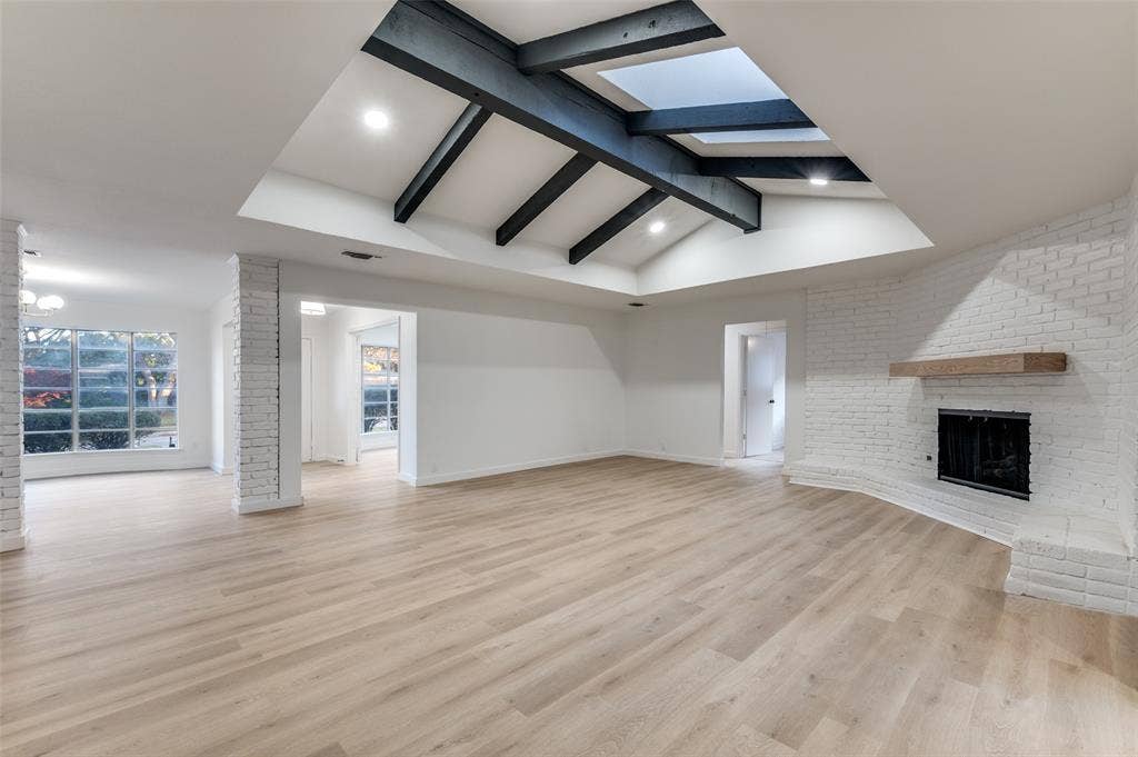 2601 Red Oak Lane, Plano, TX 75075 Recessed lighting was added throughout the home as a modern amenity. The expansive living room, with easy access to dining, makes for the perfect gathering space.
