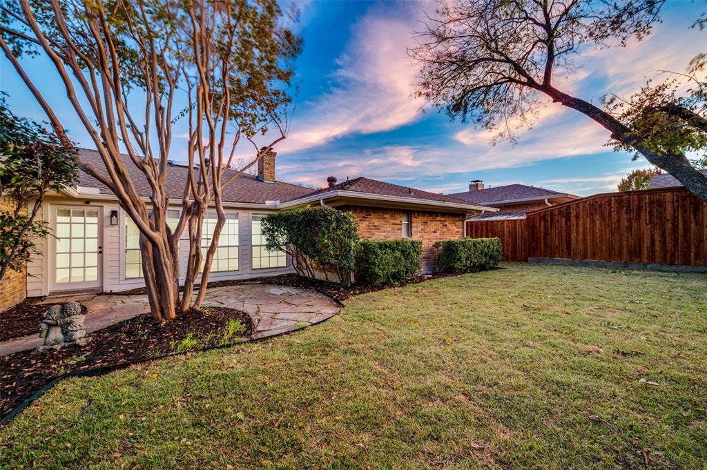 2601 Red Oak Lane, Plano, TX 75075 Private backyard retreat with fresh sod and manicured lawn—perfect for entertaining, pets, or relaxed evenings outdoors.